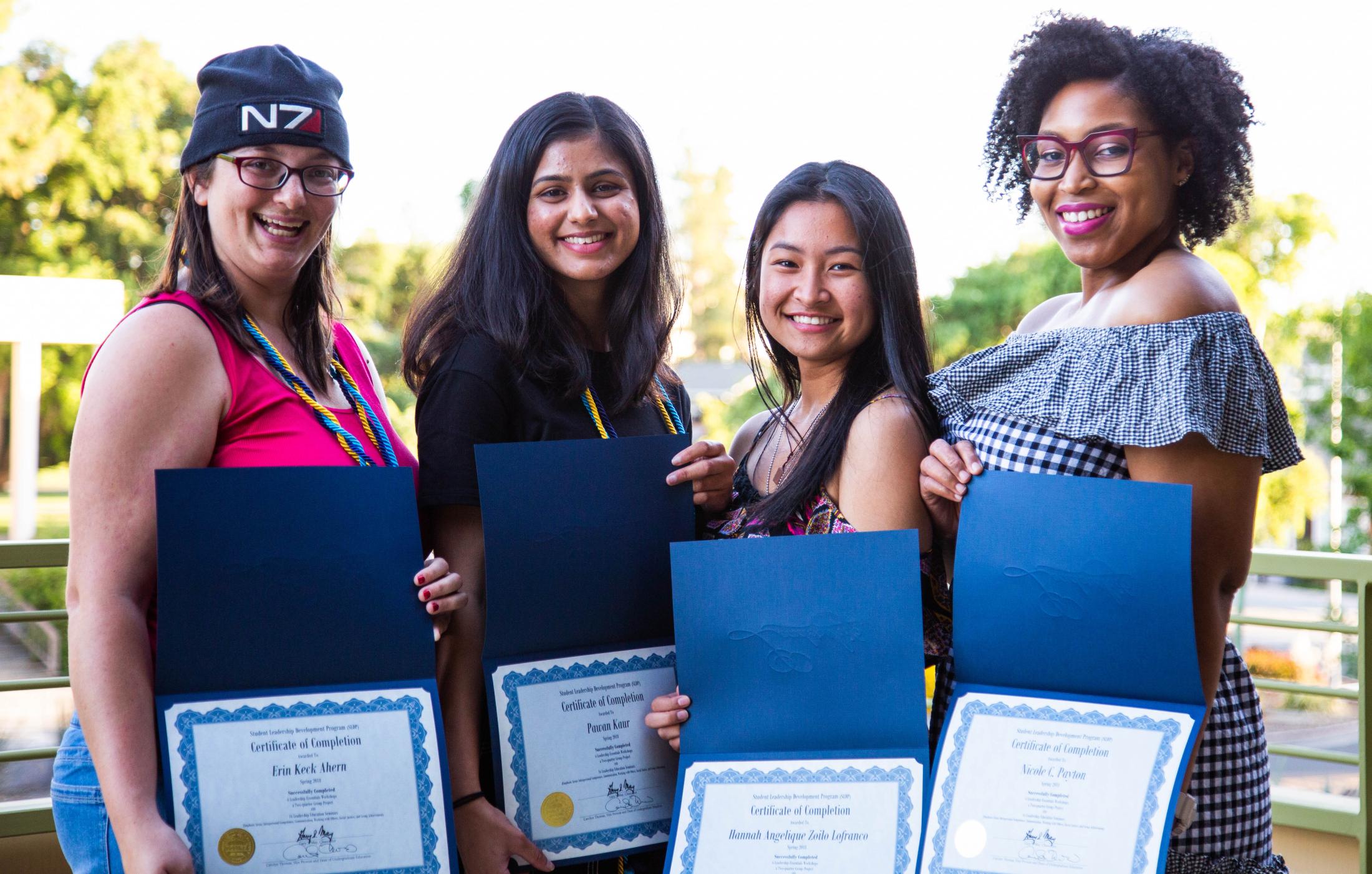 Students showcasing their SLDP certificates